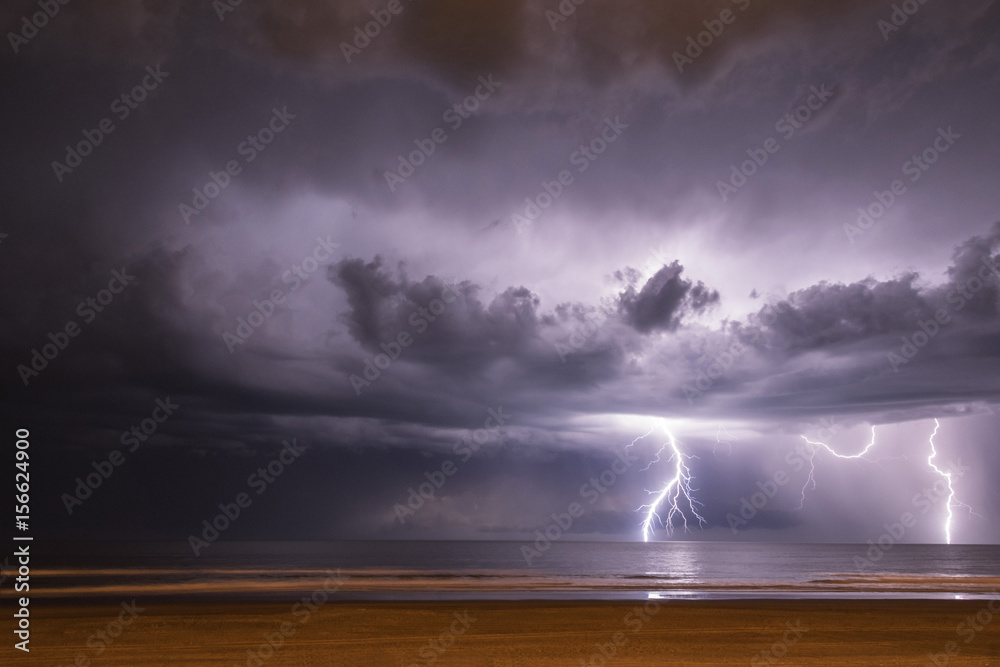 Lightning on the sea from the beach Lightning on the sea from the beach