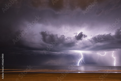 Lightning on the sea from the beach