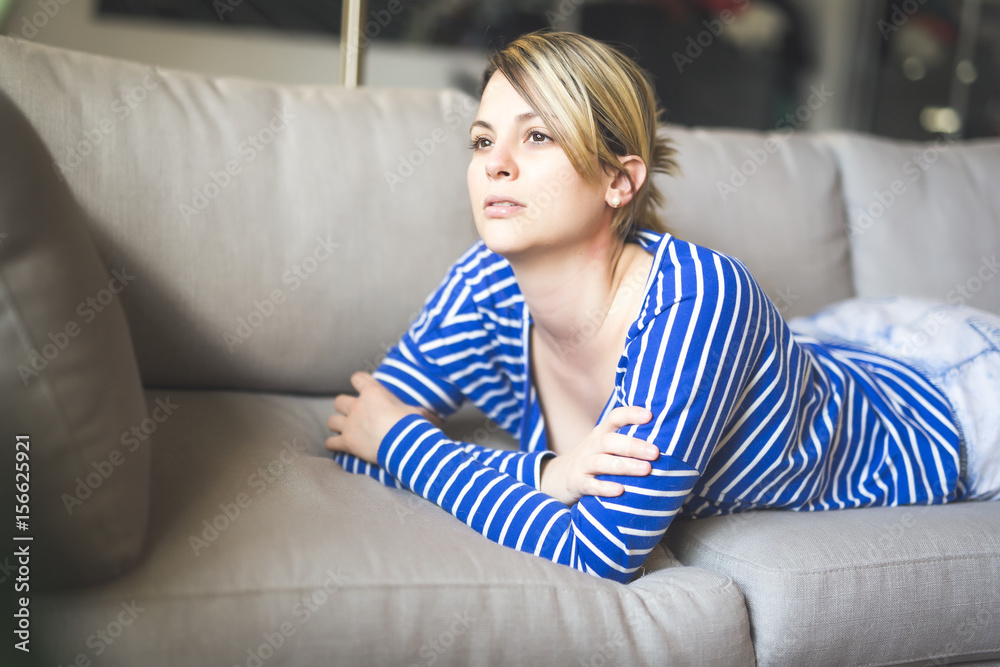 woman sitting on the couch take some good time woman sitting on the couch take some good time