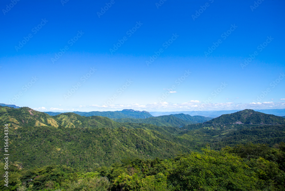 Mountain scenery, clouds, meadow with bright air.