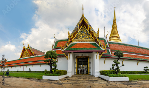 Wat Phra Kaew or the Temple of the Emerald Buddha as seen from the Outer Court, Bangkok, Thailand. The road along the temple walls