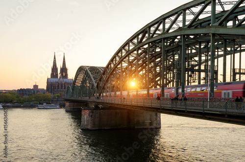 Cologne, Germany. Image of Cologne with Cologne Cathedral and railway during sunset in Germany. © ake1150