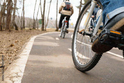 Girl on bicycle in Bitsa park, Moscow, Russia photo