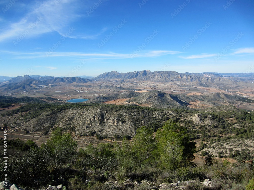 mountain landscape with valley and reservoir