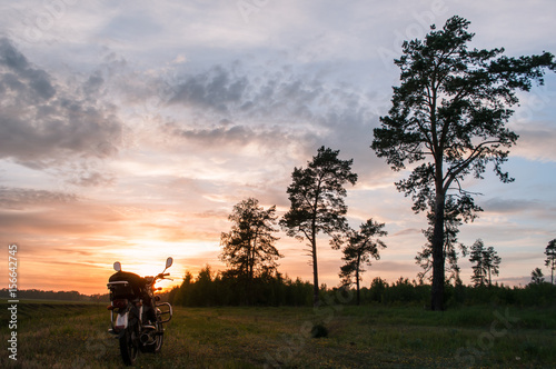classic motorcycle on a sunset background,