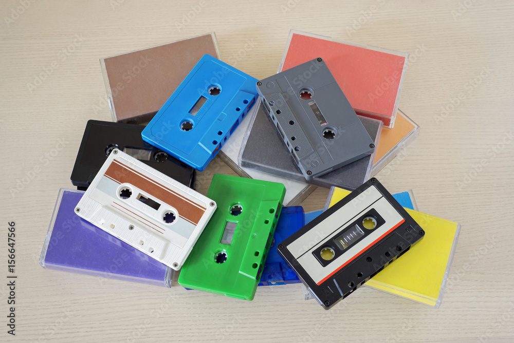 Retro colorful audio tapes and cases on the table Retro colorful audio tapes and cases on the table