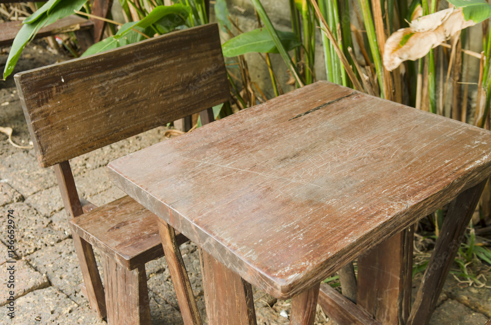 Fototapeta premium Old wooden table in the garden