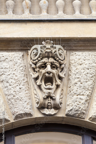 Relief on facade of old building, mascaron ornament, Prague, Czech Republic