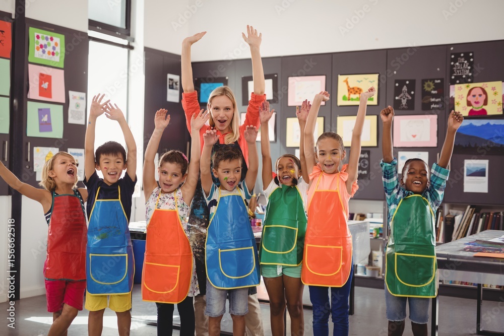Fototapeta premium Portrait of teacher and schoolkids having fun
