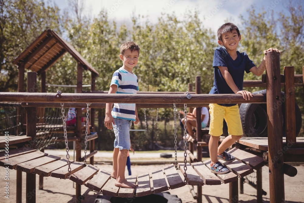 Happy schoolkids playing in playground Happy schoolkids playing in playground
