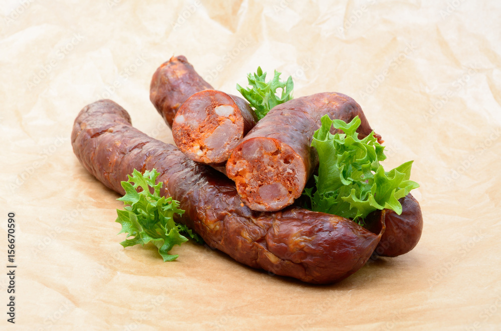 Delicious high quality smoked sausage on a crumpled paper