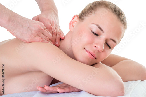 Massage therapist working with patient, massaging his Shoulders. Closeup image.