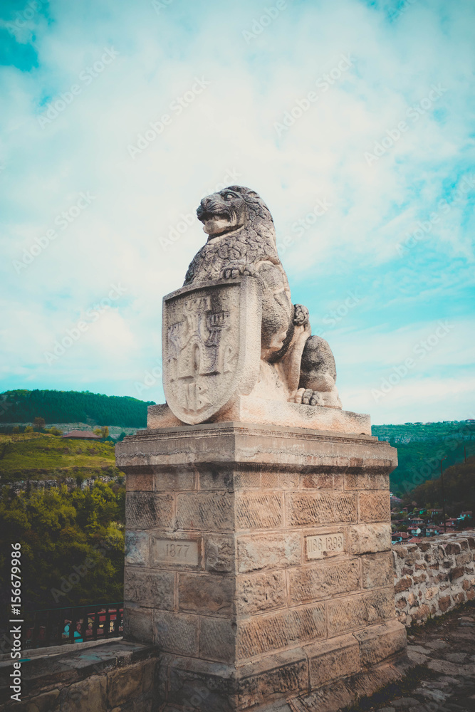 Veliko Tarnovo city, old capital of Bulgaria, Europe. Spring season. Lion sculpture at the castle Tsarevets Castle entrance.