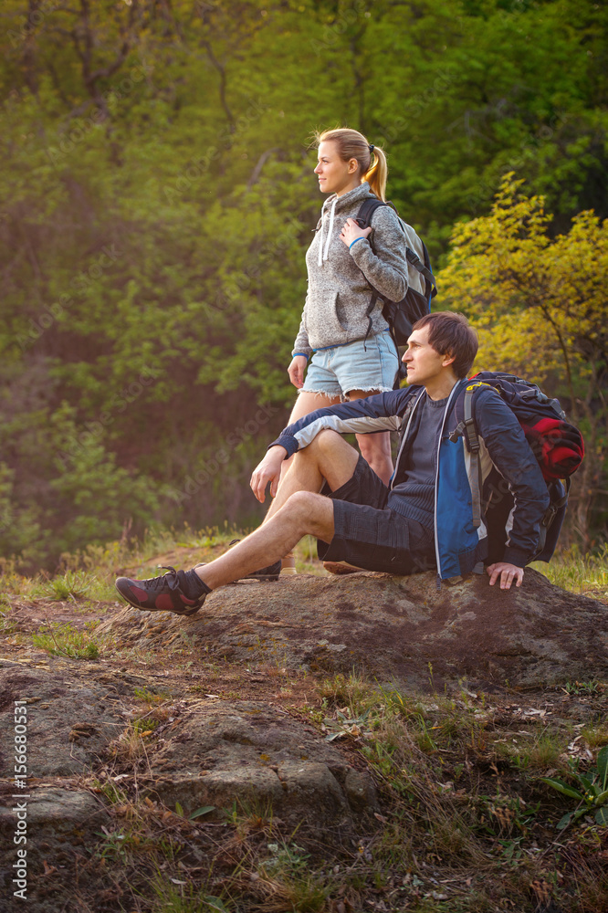 Hiker take a rest during hiking. Travel, vacation, holidays and adventure concept.