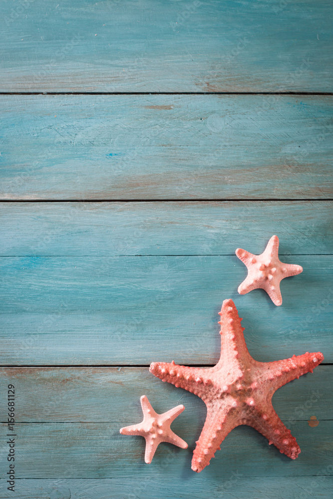 Summer time sea vacation background with star fish, marine rope on dark blue background Summer time sea vacation background with star fish, marine rope on dark blue background
