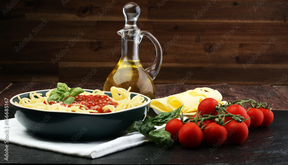 Plate of delicious spaghetti Bolognaise or Bolognese with savory minced beef and tomato sauce garnished with parmesan cheese and basil Plate of delicious spaghetti Bolognaise or Bolognese with savory minced beef and tomato sauce garnished with parmesan cheese and basil
