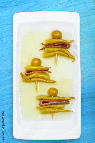Fototapeta Naklejka Na Ścianę i Meble -  Three Gilda, typical spanish pincho with olive, anchovy and green chilli.