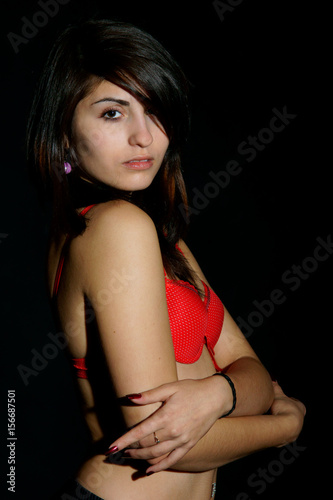 young pretty woman wearing lingerie and looking in camera
