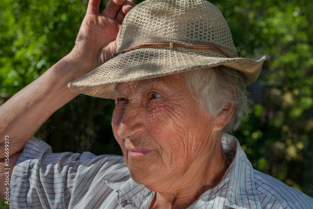 Older woman with hat.