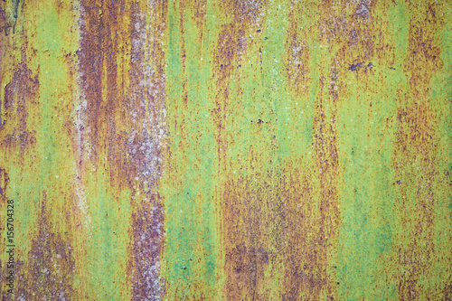 green withered paint on rusty metal grunge texture
