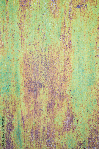 green withered paint on rusty metal grunge texture © Thomas