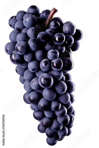 Berries of dark bunch of grape low light isolated on white background, water drops