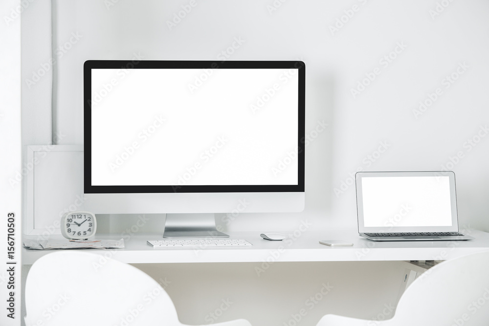 Light workplace with empty gadgets Light workplace with empty gadgets