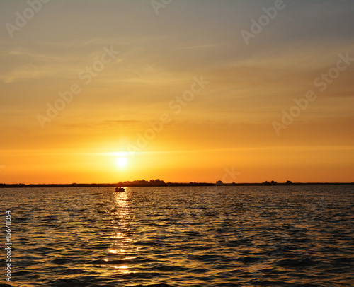 Amazing sunrise in nature reservation of Danube delta, Romania © elephotos