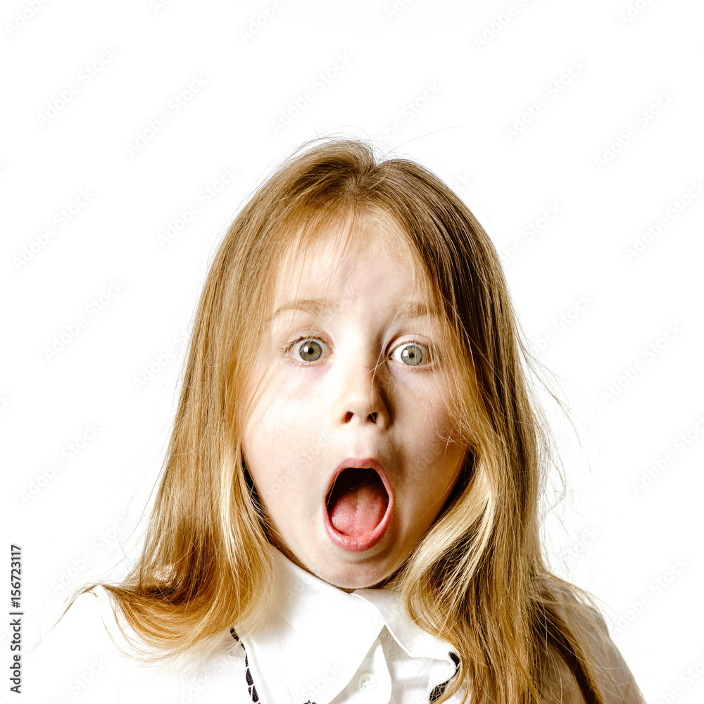 Cute little girl posing for advertising, making signes by hands and face expressions Cute little girl posing for advertising, making signes by hands and face expressions