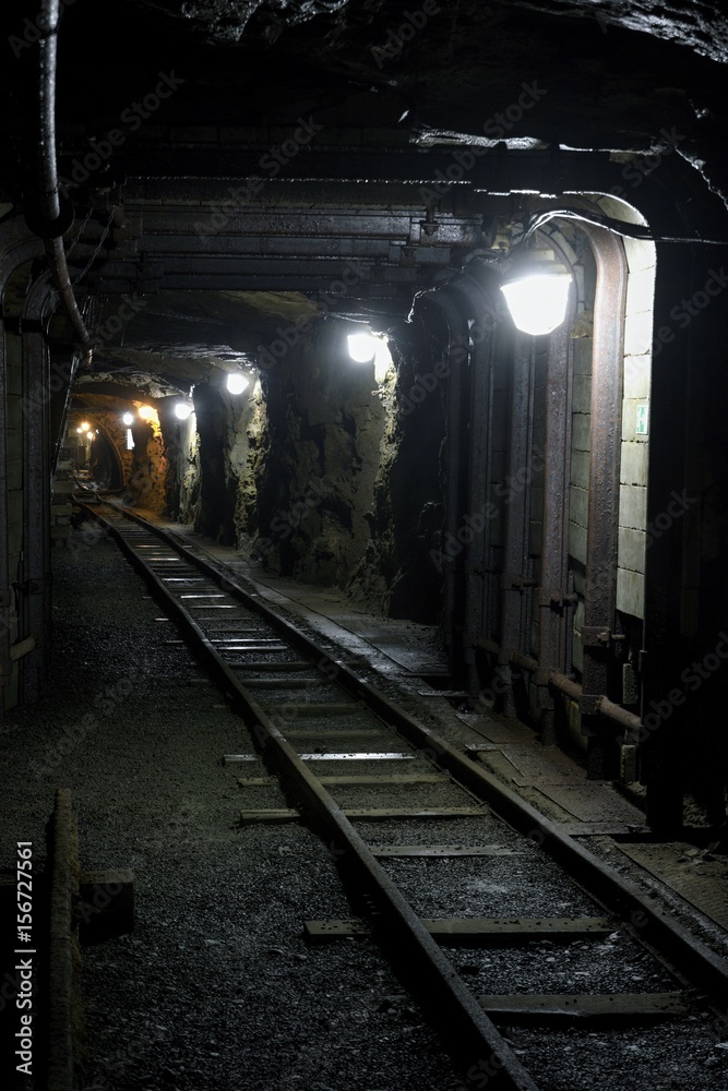 Old dark dangerous mine corridor