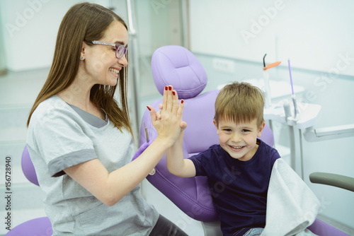 A little boys first check up. Kid visits the dentists office for the first time