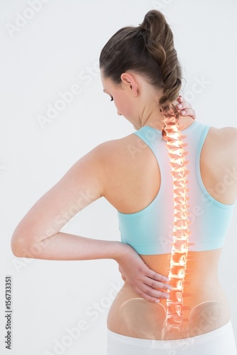 Rear view of woman suffering from pain photo