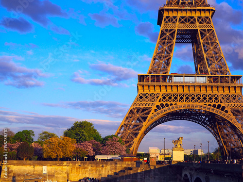 Eiffel Tower, bridge with sculpture on River Seine in Paris, France