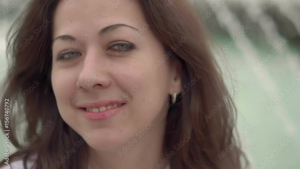 Portrait of a young attractive caucasian girl close-up, she looking at camera and smiling, HD 1920x1080 Portrait of a young attractive caucasian girl close-up, she looking at camera and smiling, HD 1920x1080