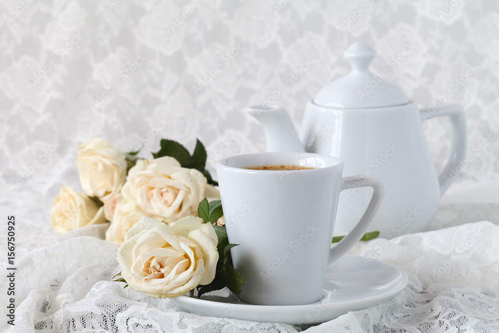cup with a saucer. Delicate white flowers roses. cup with a saucer. Delicate white flowers roses.