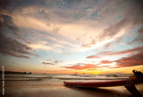 surfboard on the shore at sunset © luckybusiness