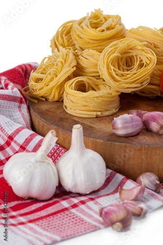 Raw fettuccine with garlic, onions and napkin cloth
