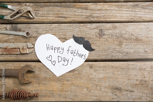 heart shape paper with happy fathers day text  photo