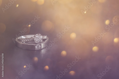 Diamond wedding ring on smoke background photo