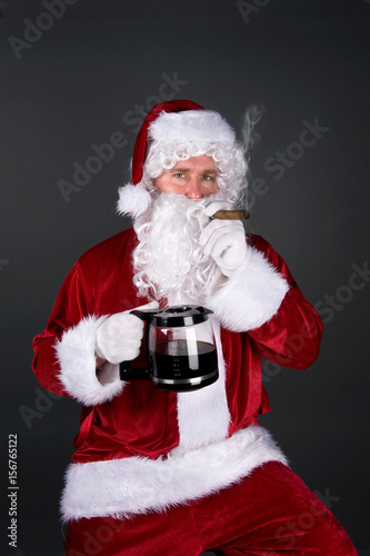 Santa Claus smoking a cigar and drinking coffee