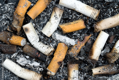 Burnt cigarette butts and ashes