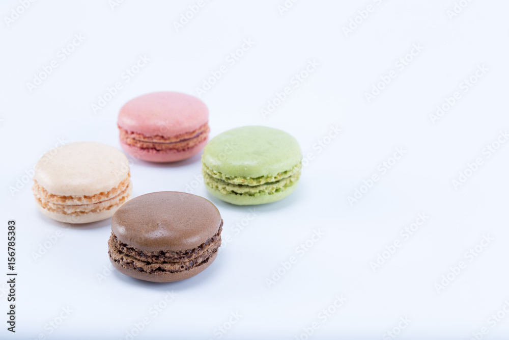 Four tasty and colorful macarons isolated on white background Four tasty and colorful macarons isolated on white background