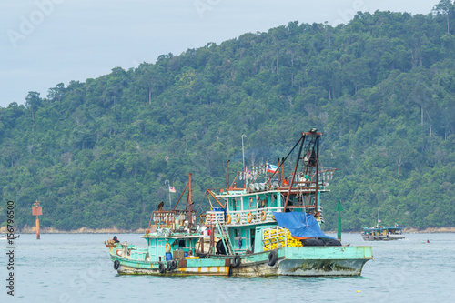 Fisherman boats anchored at Kota Kinabalu (KK). KK is a major city with unquestionably some of the best beaches on the Borneo island. photo