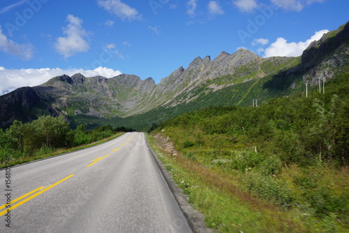 Driving on a road in the fjords in the Lofoten Islands, Norway