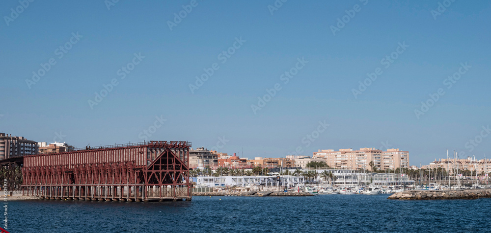 Loading platform of mineral placed in Almeria (Spain) of the society, Eclectic style, it was built by Gustave Eiffel school in 1908,  On the right is the marina of the city, Almeria, Spain