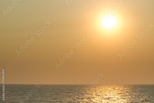 Landscape of the big sun over the sea close up.