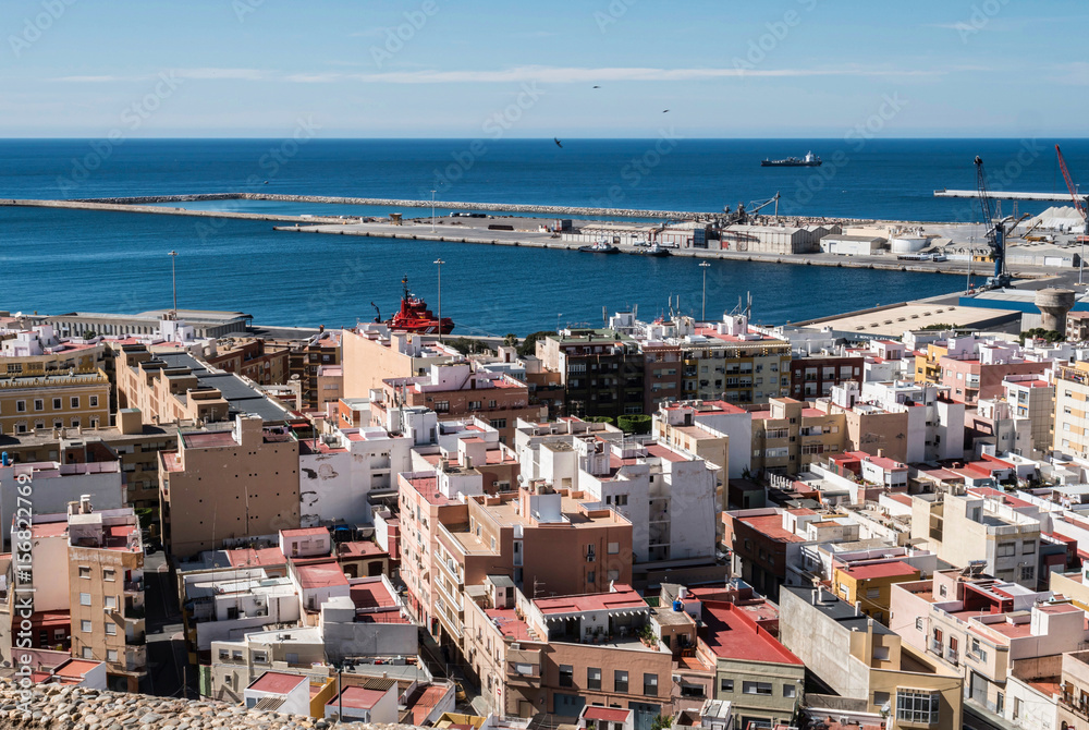 View from the fortress of Moorish houses and buildings along the port of Almeria, Andalusia, Spain