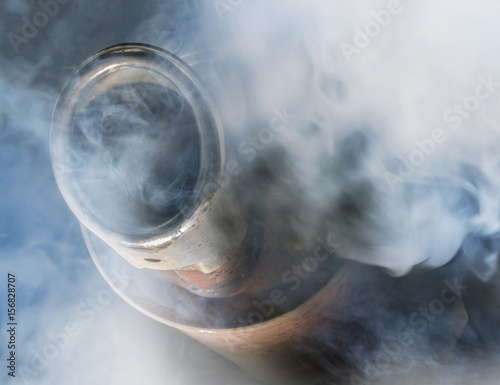 Exhaust gas from a car with diesel engine photo