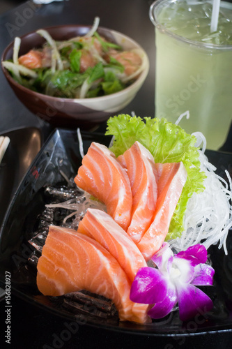 Set Of Sliced Salmon Sashimi And Green Tea