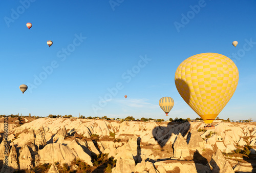 Hot air balloons flying over valley in the morning. Cappadocia. Turkey